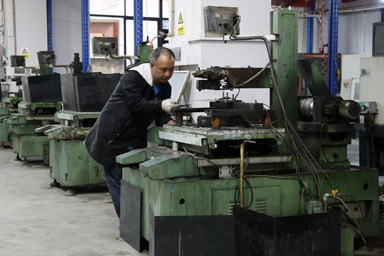 machine in Custom Signage Factory