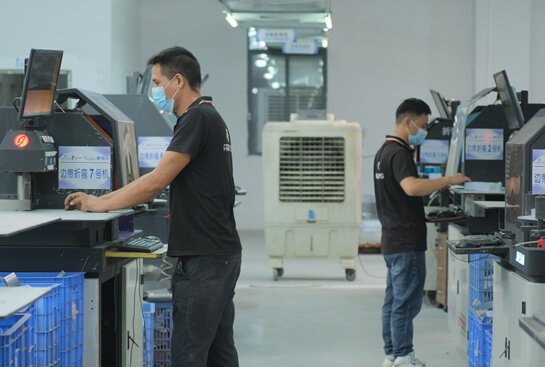 machine in Custom Signage Factory